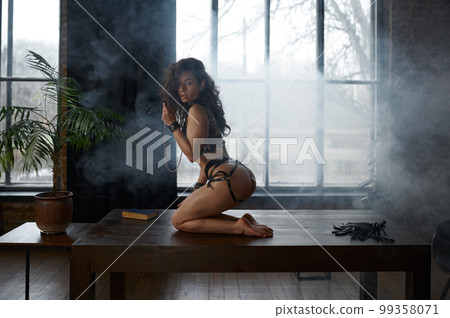 Side view portrait of confident lover wearing sexy lingerie 99358071