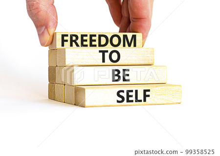Freedom to be self symbol. Concept words Freedom to be self on wooden blocks on a beautiful white table white background. Businessman hand. Business, psychological freedom to be self concept. Freedom to be self symbol. Concept words Freedom to be self on wooden blocks on a beautiful white table white background. Businessman hand. Business, psychological freedom to be self concept. 99358525