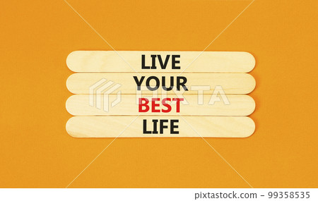 Live your best life symbol. Concept words Live your best life on wooden stick. Beautiful orange table orange background. Business live your best life concept. Copy space. Live your best life symbol. Concept words Live your best life on wooden stick. Beautiful orange table orange background. Business live your best life concept. Copy space. 99358535