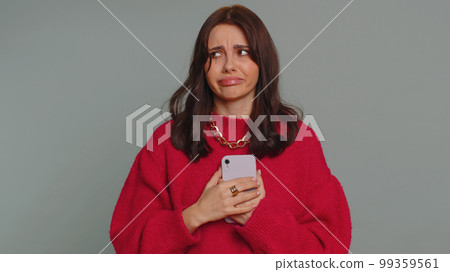 Woman use smartphone typing browsing, loses becoming surprised sudden lottery results, bad fortune Woman use smartphone typing browsing, loses becoming surprised sudden lottery results, bad fortune 99359561