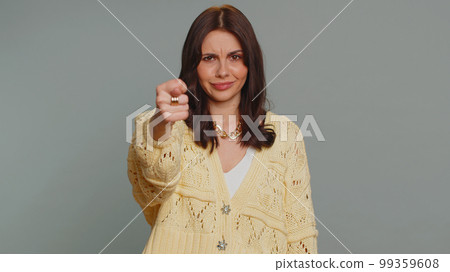 Angry aggressive woman showing fig negative gesture, you dont get it anyway, rapacious, avaricious Angry aggressive woman showing fig negative gesture, you dont get it anyway, rapacious, avaricious 99359608