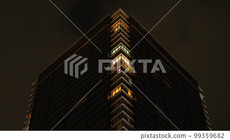 In front of Hiroshima Station in the middle of the night, a skyscraper rises in the dark night 99359682