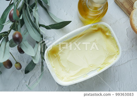 olive butter spread in container on table olive butter spread in container on table 99363083