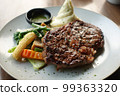 beef steaks meat with vegetables on a plate  99363320
