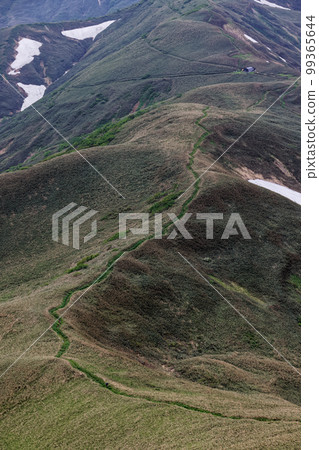 Climbers near the Joetsu border and Yomogi Pass in early summer 99365644