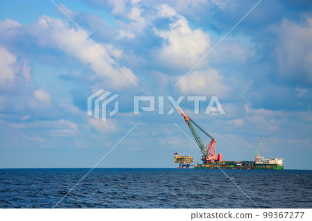 The installation oil and gas platform project in the gulf or the sea by crane barge. The project was support oil and gas industry. The heavy lift was performed by high technical and engineering. 99367277