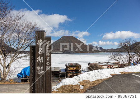 The shores of Lake Haruna on a clear winter day Haruna Fuji seen from the frozen shore 99367751