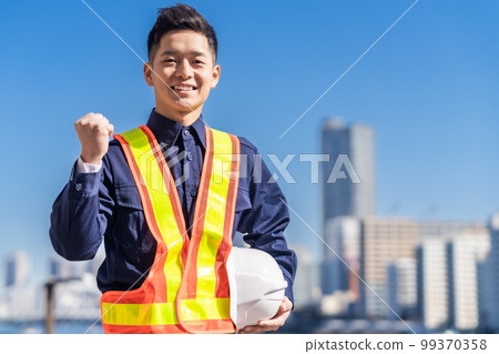 Security staff doing a guts pose 99370358