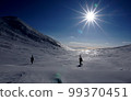 Climbers walking through Futatsuike Camp Site on the Shiretoko Peninsula in winter 99370451