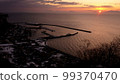 Morning sun rising from the Shiretoko Peninsula and Northern Territories in winter 99370470