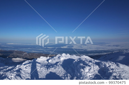 Sea of Okhotsk and drift ice seen from Mt. Sashirui, Shiretoko Peninsula in winter 99370475