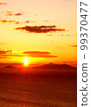 Morning sun rising from Kunashiri Island in Shiretoko Peninsula in winter 99370477