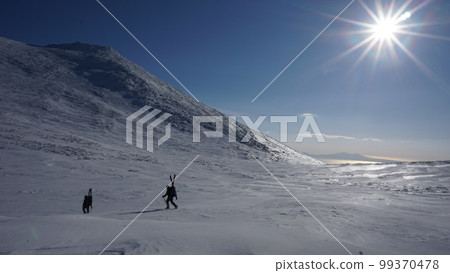 Climbers walking through the frozen Futatsuike Campsite on the Shiretoko Peninsula in winter Climbers walking through the frozen Futatsuike Campsite on the Shiretoko Peninsula in winter 99370478