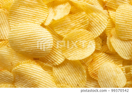 crispy golden potato chips snack texture background crispy golden potato chips snack texture background 99370542