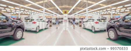 new cars in showroom interior blurred abstract background new cars in showroom interior blurred abstract background 99370833