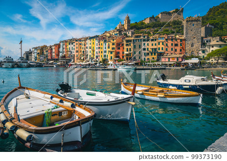 Colorful buildings and fishing boats in harbor, Porto Venere, Italy 99373190