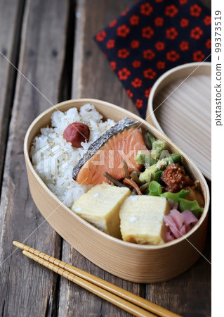 Handmade Japanese lunch box with grilled salmon in a bento box 99373519