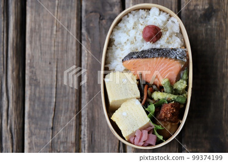 Handmade Japanese lunch box with grilled salmon in a bento box 99374199