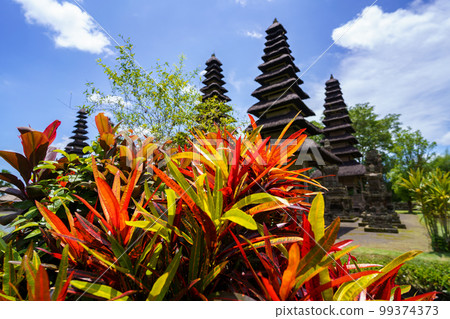 Tropical plants and multi-story tower Meru of the World Heritage Taman Ayun Temple (Bali, Indonesia) 99374373