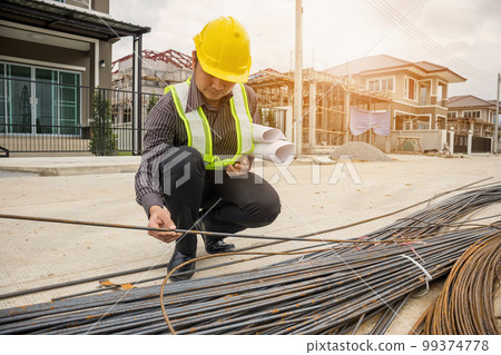 professional engineer worker at the house building construction site professional engineer worker at the house building construction site 99374778