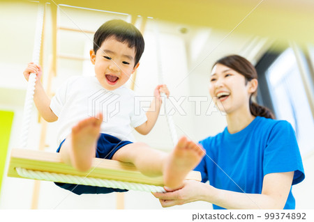 Indoor childcare image _ swing 99374892