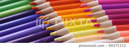 Colored pencils closeup. Collection of colored pencils in row Colored pencils closeup. Collection of colored pencils in row 99375152