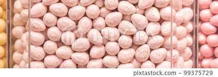 Pastel pink candies in a shop window Pastel pink candies in a shop window 99375729