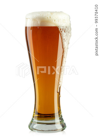 Glass of beer on white background. The foam of the drink pours over the glass. 99378410