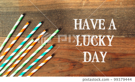 Have A Lucky Day on a wooden background Have A Lucky Day on a wooden background 99379444