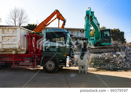 Demolition work site Heavy backhoe 99379597