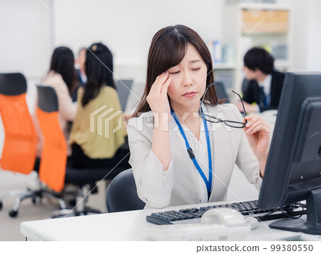 Office worker woman suffering from dry eye 99380550
