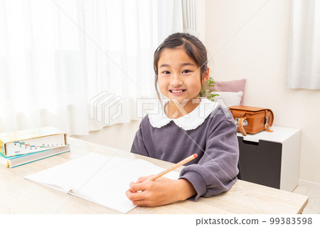 Girl learning at home 99383598
