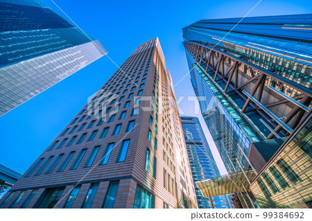 Tokyo cityscape in Japan View of Shiodome office group with clear blue sky Tokyo cityscape in Japan View of Shiodome office group with clear blue sky 99384692