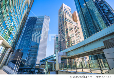 Tokyo cityscape in Japan View of Shiodome office group with clear blue sky Tokyo cityscape in Japan View of Shiodome office group with clear blue sky 99384852