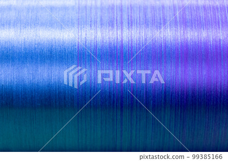 Closed up of blue and violet color of thread textured background (Focus at center of picture) Closed up of blue and violet color of thread textured background (Focus at center of picture) 99385166