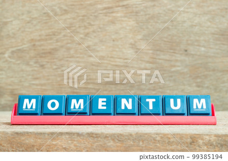 Tile alphabet letter with word momentum in red color rack on wood background 99385194