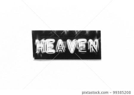 Black color banner that have embossed letter with word heaven on white paper background 99385208