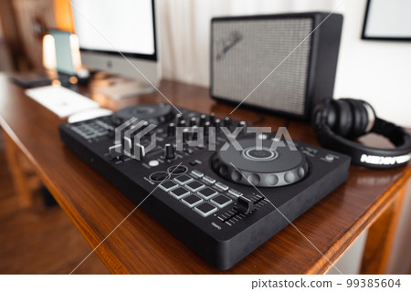 dj controller,DJ Spinning, Mixing, and Scratching in house 99385604