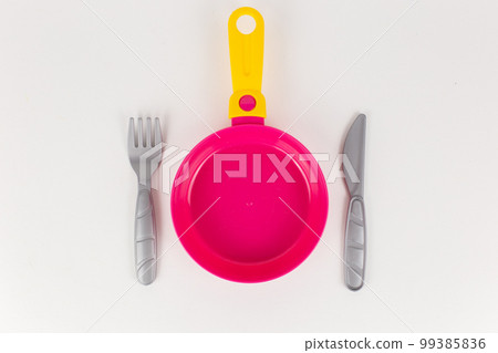 children's toy plastic frying pan on a white background children's toy plastic frying pan on a white background 99385836
