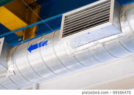 Ventilation hood pipe with air intake grille. Industrial hood in workshop.. Ventilation hood pipe with air intake grille. Industrial hood in workshop.. 99386479