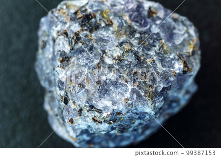 Crystal of cordierite iolite gem stone cutout, raw mineral, black background 99387153