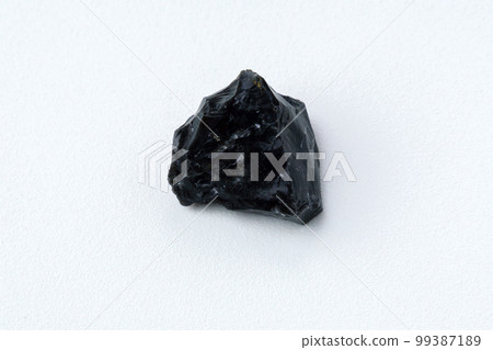 Obsidian rock. Volcanic material. Rough edges. Sharpest rock white background 99387189