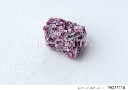 Mineral stone lepidolite. Macro shooting of natural gemstone. The raw mineral, white backround Mineral stone lepidolite. Macro shooting of natural gemstone. The raw mineral, white backround 99387216