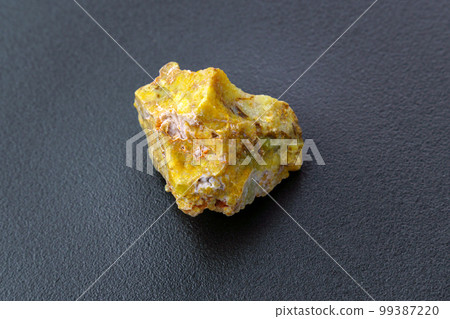 Rough yelow opal crystal, unpolished mineral. Close-up, black background Rough yelow opal crystal, unpolished mineral. Close-up, black background 99387220