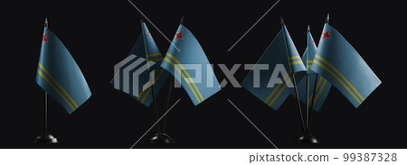 Small national flags of the Aruba on a black background 99387328