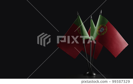 Small national flags of the Portugal on a black background 99387329