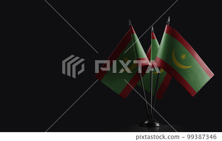 Small national flags of the Mauritania on a black background Small national flags of the Mauritania on a black background 99387346