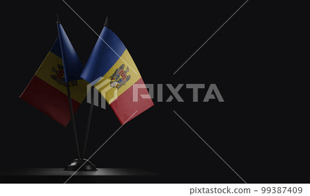 Small national flags of the Moldavia on a black background 99387409