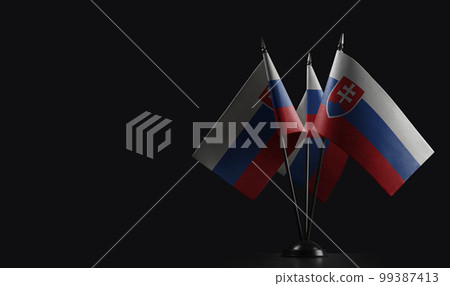 Small national flags of the Slovakia on a black background 99387413