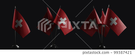 Small national flags of the Switzerland on a black background Small national flags of the Switzerland on a black background 99387421